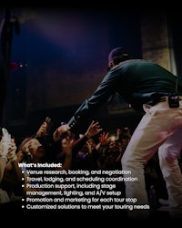 a man is standing in front of a crowd at a concert